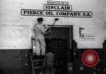 Image of Government's Oil Posters pasted on other companies oil posters Mexico, 1938, second 17 stock footage video 65675028791