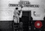 Image of Government's Oil Posters pasted on other companies oil posters Mexico, 1938, second 18 stock footage video 65675028791