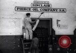 Image of Government's Oil Posters pasted on other companies oil posters Mexico, 1938, second 19 stock footage video 65675028791