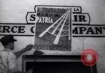 Image of Government's Oil Posters pasted on other companies oil posters Mexico, 1938, second 28 stock footage video 65675028791