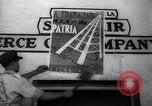 Image of Government's Oil Posters pasted on other companies oil posters Mexico, 1938, second 32 stock footage video 65675028791
