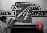 Image of Government's Oil Posters pasted on other companies oil posters Mexico, 1938, second 33 stock footage video 65675028791