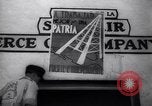 Image of Government's Oil Posters pasted on other companies oil posters Mexico, 1938, second 35 stock footage video 65675028791