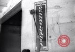 Image of Government's Oil Posters pasted on other companies oil posters Mexico, 1938, second 41 stock footage video 65675028791