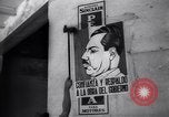 Image of Government's Oil Posters pasted on other companies oil posters Mexico, 1938, second 43 stock footage video 65675028791