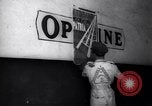 Image of Government's Oil Posters pasted on other companies oil posters Mexico, 1938, second 51 stock footage video 65675028791