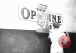 Image of Government's Oil Posters pasted on other companies oil posters Mexico, 1938, second 58 stock footage video 65675028791