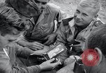 Image of US-Russian soldiers listen guitar Kaesong Korea 38th Parallel, 1945, second 6 stock footage video 65675028819