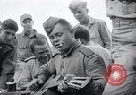 Image of US-Russian soldiers listen guitar Kaesong Korea 38th Parallel, 1945, second 40 stock footage video 65675028819
