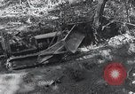 Standbild Bulldozer löscht Straße Birma, 1943, aus Sekunde 9 historischem Filmmaterial Videoclip 65675028820