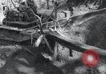 Standbild Bulldozer löscht Straße Birma, 1943, aus Sekunde 30 historischem Filmmaterial Videoclip 65675028820