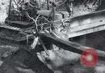 Standbild Bulldozer löscht Straße Birma, 1943, aus Sekunde 32 historischem Filmmaterial Videoclip 65675028820