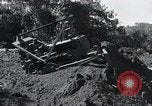 Standbild Bulldozer löscht Straße Birma, 1943, aus Sekunde 46 historischem Filmmaterial Videoclip 65675028820