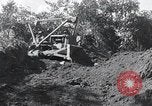 Standbild Bulldozer löscht Straße Birma, 1943, aus Sekunde 51 historischem Filmmaterial Videoclip 65675028820