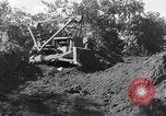 Standbild Bulldozer löscht Straße Birma, 1943, aus Sekunde 52 historischem Filmmaterial Videoclip 65675028820