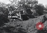 Standbild Bulldozer löscht Straße Birma, 1943, aus Sekunde 53 historischem Filmmaterial Videoclip 65675028820