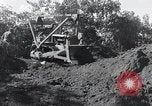 Standbild Bulldozer löscht Straße Birma, 1943, aus Sekunde 54 historischem Filmmaterial Videoclip 65675028820