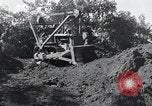 Standbild Bulldozer löscht Straße Birma, 1943, aus Sekunde 55 historischem Filmmaterial Videoclip 65675028820