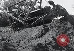 Standbild Bulldozer löscht Straße Birma, 1943, aus Sekunde 61 historischem Filmmaterial Videoclip 65675028820