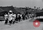 Image of Korean refugees at Tent City Kaesong Korea, 1947, second 18 stock footage video 65675028822