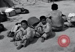 Image of Korean refugees at Tent City Kaesong Korea, 1947, second 48 stock footage video 65675028822