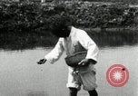 Standbild koreanischen Bauern streut Samen in Reis Bereich Korea, 1936, aus Sekunde 37 historischem Filmmaterial Videoclip 65675028844