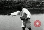 Standbild koreanischen Bauern streut Samen in Reis Bereich Korea, 1936, aus Sekunde 39 historischem Filmmaterial Videoclip 65675028844