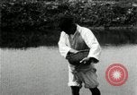 Standbild koreanischen Bauern streut Samen in Reis Bereich Korea, 1936, aus Sekunde 40 historischem Filmmaterial Videoclip 65675028844
