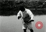Standbild koreanischen Bauern streut Samen in Reis Bereich Korea, 1936, aus Sekunde 41 historischem Filmmaterial Videoclip 65675028844