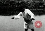 Standbild koreanischen Bauern streut Samen in Reis Bereich Korea, 1936, aus Sekunde 45 historischem Filmmaterial Videoclip 65675028844