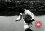 Standbild koreanischen Bauern streut Samen in Reis Bereich Korea, 1936, aus Sekunde 46 historischem Filmmaterial Videoclip 65675028844