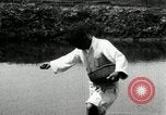 Standbild koreanischen Bauern streut Samen in Reis Bereich Korea, 1936, aus Sekunde 47 historischem Filmmaterial Videoclip 65675028844