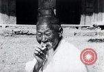 Image of Devil Post in crop field Korea, 1936, second 23 stock footage video 65675028853