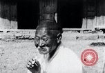 Image of Devil Post in crop field Korea, 1936, second 30 stock footage video 65675028853