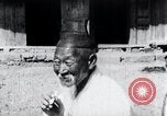 Image of Devil Post in crop field Korea, 1936, second 31 stock footage video 65675028853
