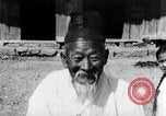 Image of Devil Post in crop field Korea, 1936, second 34 stock footage video 65675028853