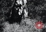 Image of Korean farmer's wife and son collect wood Korea, 1936, second 50 stock footage video 65675028854