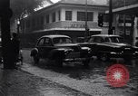 Image of cars moving in heavy rain Saigon Vietnam, 1955, second 5 stock footage video 65675028887
