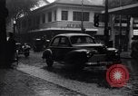 Image of cars moving in heavy rain Saigon Vietnam, 1955, second 6 stock footage video 65675028887