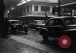 Image of cars moving in heavy rain Saigon Vietnam, 1955, second 7 stock footage video 65675028887