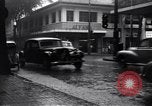 Image of cars moving in heavy rain Saigon Vietnam, 1955, second 8 stock footage video 65675028887
