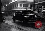 Image of cars moving in heavy rain Saigon Vietnam, 1955, second 9 stock footage video 65675028887