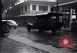 Image of cars moving in heavy rain Saigon Vietnam, 1955, second 12 stock footage video 65675028887