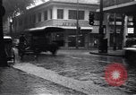 Image of cars moving in heavy rain Saigon Vietnam, 1955, second 13 stock footage video 65675028887
