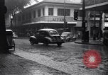 Image of cars moving in heavy rain Saigon Vietnam, 1955, second 17 stock footage video 65675028887