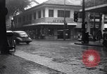Image of cars moving in heavy rain Saigon Vietnam, 1955, second 18 stock footage video 65675028887
