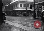 Image of cars moving in heavy rain Saigon Vietnam, 1955, second 19 stock footage video 65675028887