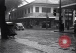 Image of cars moving in heavy rain Saigon Vietnam, 1955, second 22 stock footage video 65675028887