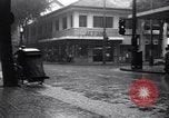 Image of cars moving in heavy rain Saigon Vietnam, 1955, second 23 stock footage video 65675028887