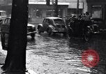 Image of cars moving in heavy rain Saigon Vietnam, 1955, second 24 stock footage video 65675028887